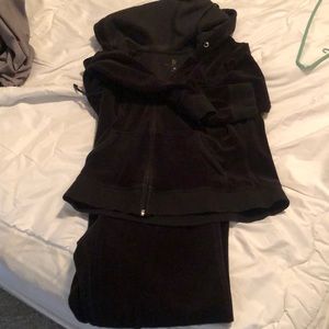 Velour woman’s wind suit, jacket is a medium but the pants are a size small.